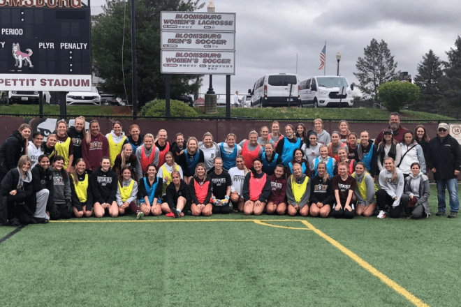 Group photo of the 2023 Women's Soccer Alumni game attendees